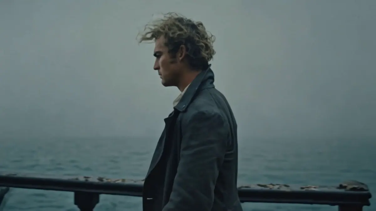 Keyframe II: the pirate, in profile, stands at the rail and looks out over a grey, foggy sea.